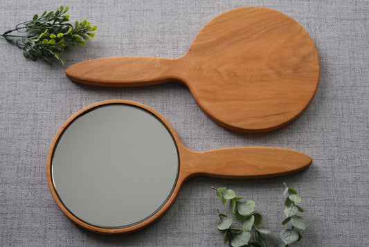 Wood hand mirror made from solid Cherry hardwood. Front and back view shown featuring a 6 inch beveled glass mirror.